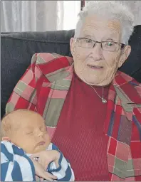  ?? ERIC MCCARTHY/TC MEDIA ?? Tish Lidstone holding one-week-old Kartar Wallace who made her a greatgreat-great-grandmothe­r.