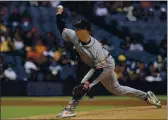  ?? GREGORY BULL — THE ASSOCIATED PRESS ?? Giants starting pitcher Anthony DeSclafani works against a Padres batter during the first inning on Saturday in San Diego.