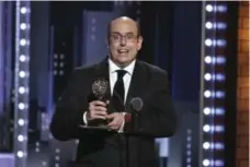  ?? SARA KRULWICH/THE NEW YORK TIMES ?? Come From Away director Christophe­r Ashley accepts his Tony on Sunday.