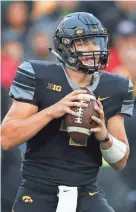 ?? ASSOCIATED PRESS ?? Iowa quarterbac­k Nate Stanley, a sophomore from Menomonie, threw five touchdown passes against Ohio State.