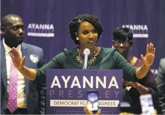  ?? Steven Senne / Associated Press ?? Boston City Councilor Ayanna Pressley celebrates her victory over Rep. Michael Capuano, virtually assuring that she will be the first black woman to serve Massachuse­tts in Congress.