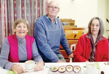  ??  ?? (8b) About to enjoy the cream cheese, yoghurt filled with a dob of apricot jam inside a half shell of a large chocolate Easter egg is Hillview resident's Lilian Graham pictured on the right with her sister and brother in law from Nar Nar Goon Jean and...