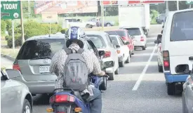  ?? FILE ?? A motorcycli­st driving through traffic in the Corporate Area.