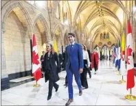  ?? SEAN KILPATRICK/THE CANADIAN PRESS ?? Governor General Julie Payette walks with Prime Minister Justin Trudeau as she arrives on Parliament Hill in Ottawa on Monday.