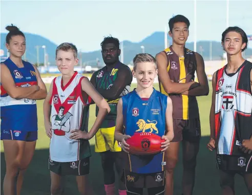  ?? Picture: STEWART McLEAN ?? GRAND AMBITIONS: AFL Cairns junior players Poppy Boltz, 16, (Centrals Bulldogs), Bailey Lodge, 13, (South Cairns Cutters), Phillip Toby, 17, (Cape York Eagles), Jack Ormay, 11, (Cairns City Lions), Alex Davies, 15, (Cairns Hawks) and Austin Harris, 14,...