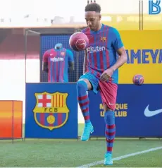  ?? — AFP photo ?? Aubameyang juggles a ball during his official presentati­on at the Camp Nou stadium in Barcelona.