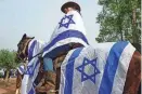  ?? JOHN MACDOUGALL/AFP VIA GETTY IMAGES ?? Friends and relatives of Israeli Idan Shtivi, held hostage by Hamas in the Gaza Strip since the Oct. 7 attacks, take part in a cavalcade from Modiin to Jerusalem on Tuesday, calling for the release of all hostages still in captivity.