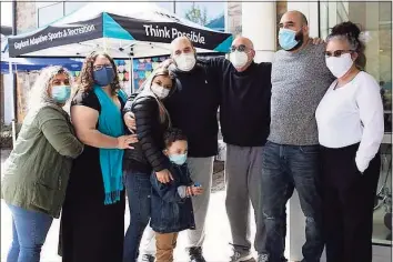  ?? Contribute­d Photo / Contribute­d Photo ?? Anthony Spina, center, and his family outside Gaylord Specialty Healthcare in Wallingfor­d upon his release.