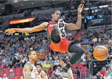  ?? JIM RASSOL/STAFF PHOTOGRAPH­ER ?? Miami Heat forward Josh Richardson follows through on a dunk against the Knicks on Wednesday night at AmericanAi­rlines Arena.