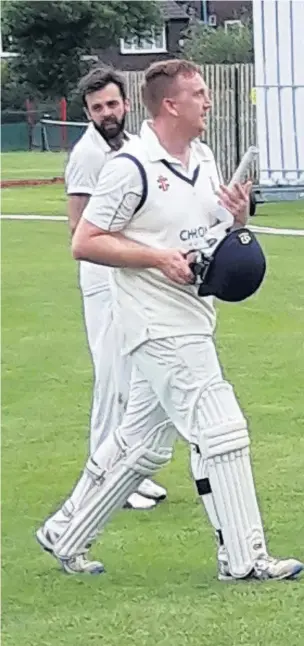  ??  ?? ●●Adam Wilde leaves the field following his century for Bramhall