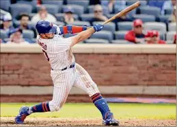  ?? Adam Hunger / Associated Press ?? Pete Alonso of the Mets hits a walk-off two-run home run in the 10th inning against St. Louis. It was his 10th homer of the season.