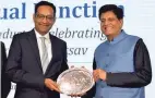  ?? ?? Shri Piyush Goyal felicitati­ng Anuj Poddar