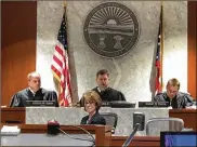  ??  ?? Judges Joe Kirby (from left), Donald Oda II and Robert Peeler preside on the first day of Christophe­r Kirby’s trial. Court reporter Debi Kilgore is in the foreground. Kirby is charged with aggravated murder and other charges.