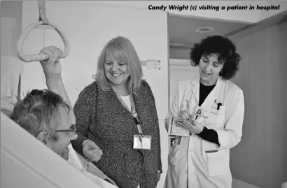  ??  ?? Candy Wright (c) visiting a patient in hospital