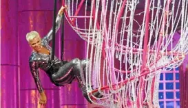  ?? Post-Gazette ?? Pop star P!NK flies onstage to start the show with "Party" on her Beautiful Trauma World Tour at PPG Paints Arena in April 2018.