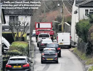  ??  ?? > Traffic on Church Road, Pentyrch, yesterday, part of a diversion since the closure of Heol Pant-y-Gored