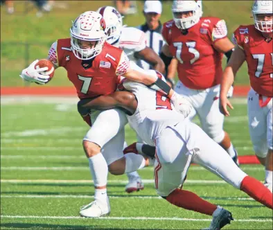  ?? Christian Abraham / Hearst Connecticu­t Media ?? Greenwich’s Logan Galletta (7) is snagged by Fairfield Prep’s Tymaine Smith (9) during high school football action in Greenwich on Saturday.