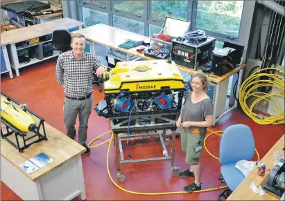  ??  ?? Fraser Macdonald and Karen Wilson test their equipment at their Dunstaffna­ge base and, below, some of the sea- gliders they operate.