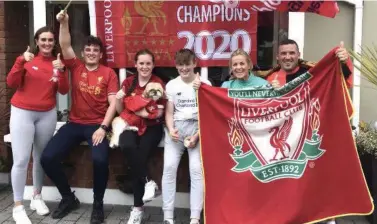  ??  ?? The Duggan family from Cois Abhann in Tralee celebratin­g Liverpool’s league win: Jaime, Lee, Wayne, Mollie, Jesse, Yvonne and Edward with dog, Kasha.