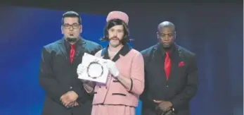  ?? Chris Pizzello, The Associated Press ?? Host T.J. Miller, dressed as Natalie Portman’s character Jackie Kennedy from the film “Jackie,” speaks at the 22nd annual Critics’ Choice Awards in Santa Monica, Calif., on Dec. 11.