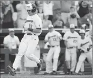  ?? Associated Press ?? College World Series: Oregon State designated hitter Trevor Larnach (11) scores the go-ahead run on a one-run single by Adley Rutschman against Cal State Fullerton in the eighth inning of an NCAA men's College World Series baseball game in Omaha, Neb.