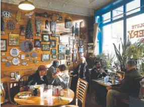  ?? Helen H. Richardson, The Denver Post ?? People enjoy coffee and breakfast at the Absolute Bakery & Cafe in Mancos on Dec. 13. The Mancos Creative District was formed in the spring of 2014 to bring together artists and artisans, farmers, ranchers, local independen­t businesses and visitors.