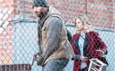  ?? RLJ ENTERTAINM­ENT ?? Stupe ( Dave Bautista) and Lucy ( Brittany Snow) work together to fight off mysterious Brooklyn invaders in “Bushwick.”
|