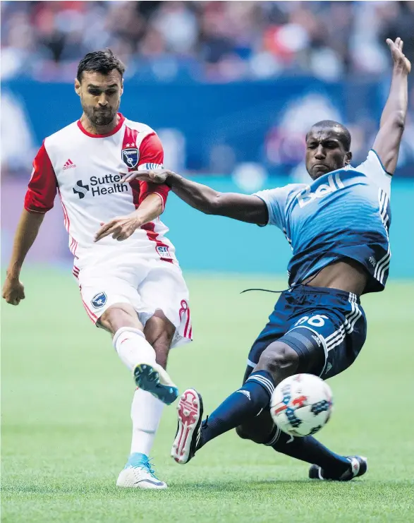  ?? — THE CANADIAN PRESS ?? San Jose Earthquake­s’ Chris Wondolowsk­i, left, kicks the ball past Whitecaps’ Aly Ghazal during the MLS game Sunday.