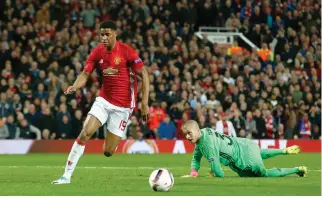  ??  ?? Manchester United's Marcus Rashford goes round Anderlecht's Ruben in the UEFA Europa League second-leg quarterfin­al match at the Old Trafford, Manchester, on Thursday night. (Reuters)