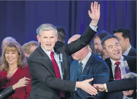  ?? GERRY KAHRMANN ?? Andrew Wilkinson waves to the crowd after being elected leader of the B.C. Liberals on Saturday night in Vancouver.