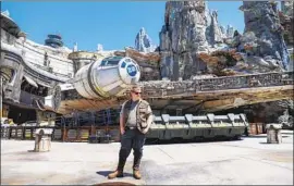  ?? Jay L. Clendenin Los Angeles Times ?? CAST MEMBERS add to the f lavor at Disneyland, here at the Millennium Falcon: Smugglers Run ride inside the theme park’s Star Wars: Galaxy’s Edge.