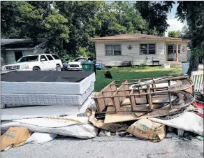  ?? AP PHOTO ?? Recently removed flood-damaged debris sits outside a home in Houston, Tx., this summer.