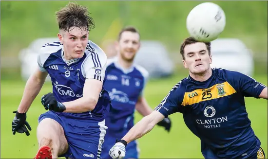  ??  ?? Coolaney/Mullinabre­ena’s Barry Gorman gets a shot at goal despite the attention of Conor McGovern of St Johns during the Belfry Senior Football Championsh­ip quarter final in Bunninadde­n. Pics: Tom Callanan.