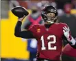  ?? JULIO CORTEZ ?? Tampa Bay Buccaneers quarterbac­k Tom Brady (12) throws a pass during the second half of an NFL wild-card playoff football game against the Washington Football Team, Saturday, Jan. 9, 2021, in Landover, Md.