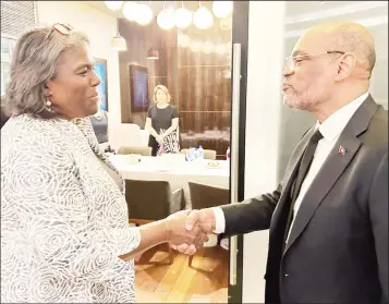  ?? ?? Linda Thomas-Greenfield (left) meeting with Haitian Prime Minister Ariel Henry (US Embassy photo)