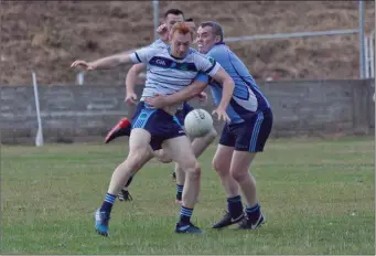  ??  ?? Shillelagh’s Ray Murphy tries to stop An Tochar’s Eamonn Wolohan getting his shot away.