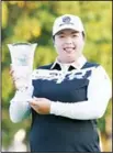  ??  ?? Shanshan Feng of China poses with the trophy after winning the LPGA Japan Classic golf tournament in Omitama, Ibaraki prefecture on Nov 5. (AFP)