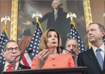  ?? Kent Nishimura Los Angeles Times ?? SPEAKER Nancy Pelosi and fellow Democrats, including Rep. Adam B. Schiff of Burbank, right, before signing two articles of impeachmen­t. Schiff said he expects new evidence to come out during the Senate trial.