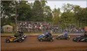  ?? CARL HESS PHOTOGRAPH­Y ?? Spectators watch 270cc Micro Sprints do a pace lap prior to the dropping of the green flag to start a race at Shellhamme­r Dirt Track in Ontelaunee Township. The 270cc Micro Sprints are one of six classes that run at the oval on “wingless” Wednesdays. The others are 125cc Micro Sprints, 600cc Micro Sprints, Stage One Modifieds, Allstar Slingshots and Junior Slingshots. The track opened to the public in 1975 as Shellhamme­rs Speedway.