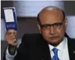  ?? SAUL LOEB/AFP/GETTY IMAGES ?? Khizr Khan addresses delegates as he holds a copy of the Constituti­on.