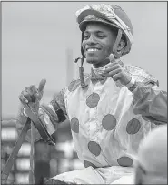  ?? Arkansas Democrat-Gazette/MITCHELL PE MASILUN ?? Ricardo Santana Jr. celebrates after riding Unbridled Mo to victory in the Apple Blossom Handicap at Oaklawn Park in Hot Springs on Friday.