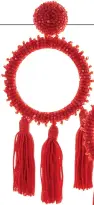  ??  ?? Garnet beaded circle with tassel earring, $490, at Oscar De La Renta.