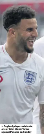  ??  ?? > England players celebrate one of John Stones’ brace against Panama on Sunday