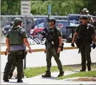  ?? Dario Lopez-Mills / Associated Press ?? Law enforcemen­t personnel stand outside Robb Elementary School following a shooting Tuesday in Uvalde, Texas.