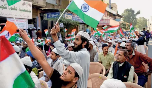  ?? AFP ?? WAVE THE FLAG Residents of Ahmedabad celebrate Republic Day, Jan. 26, 2018