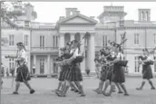  ??  ?? Argyll and Sutherland Highlander­s Pipes and Drums perform in front of Dundurn Castle.