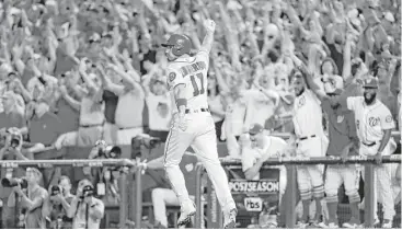  ?? Pablo Martinez Monsivais / Associated Press ?? Ryan Zimmerman’s (11) three-run home run in the eighth inning, off Cubs relief pitcher Mike Montgomery, completed the Nationals’ rally. The comeback win evens the series with Game 3 coming on Monday.