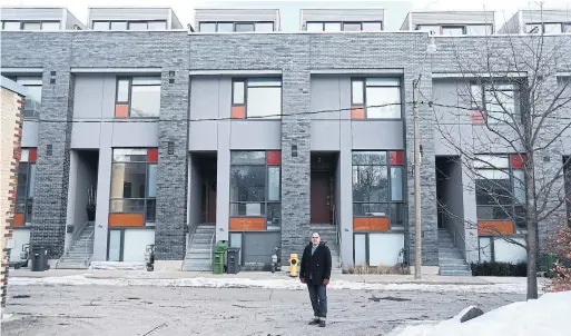  ?? STEVE RUSSELL TORONTO STAR ?? Brian Kucharski, architect/developer behind a row of eight modernist townhouses on Gilead Place, says modernist design is well-suited to demands of infill housing.