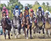  ?? Hans Pennink Associated Press ?? AMERICAN PHAROAH, center, led the field into the first turn but lost after a tough stretch run.