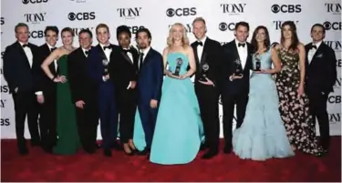 ??  ?? The cast and crew of "Dear Evan Hansen" pose in the press room with the award for best musical at the 71st annual Tony Awards on Sunday in New York. — AP/AFP photos
